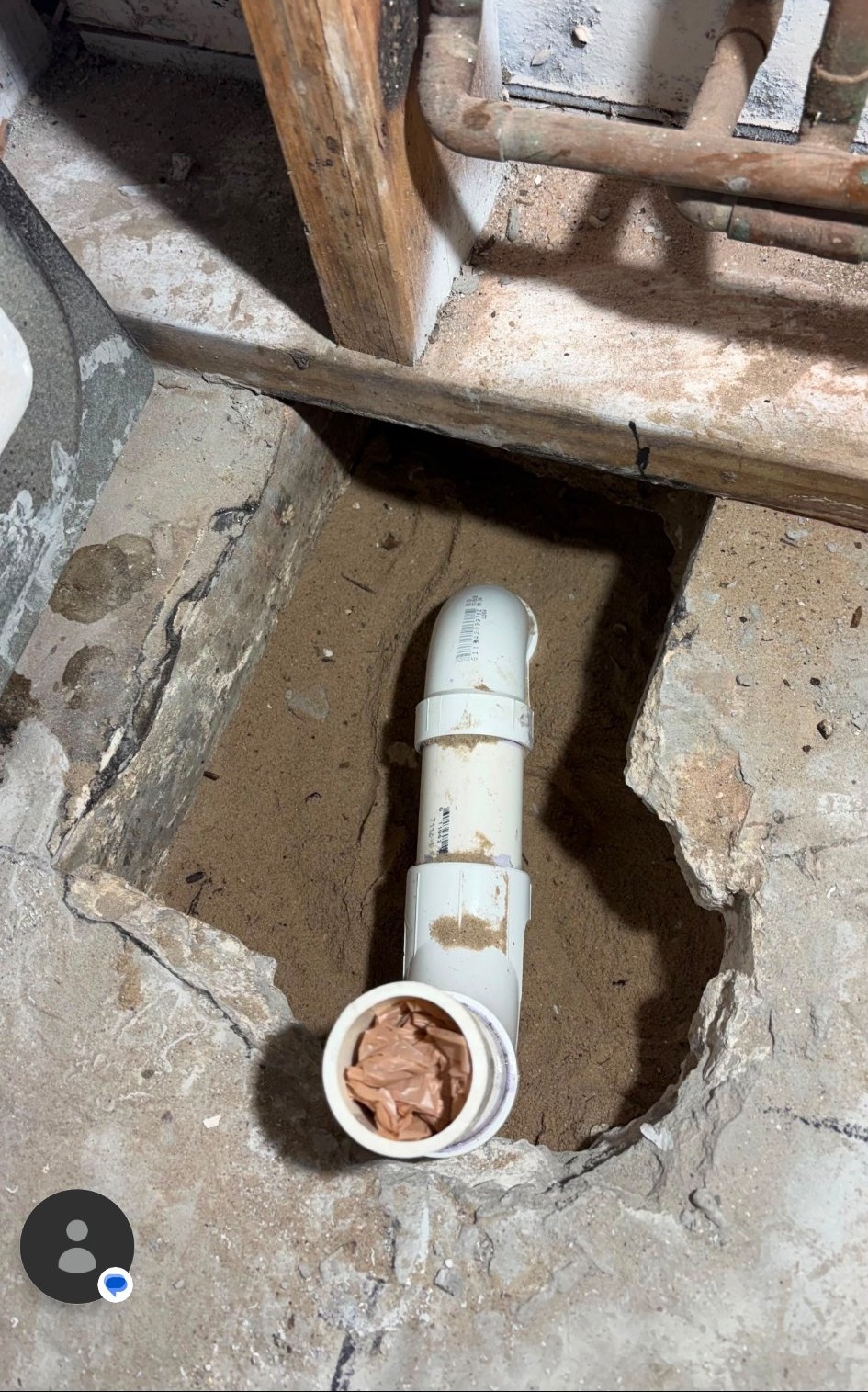 Close-up of drain rough-in piping during a bathroom remodel by Onel Construction.