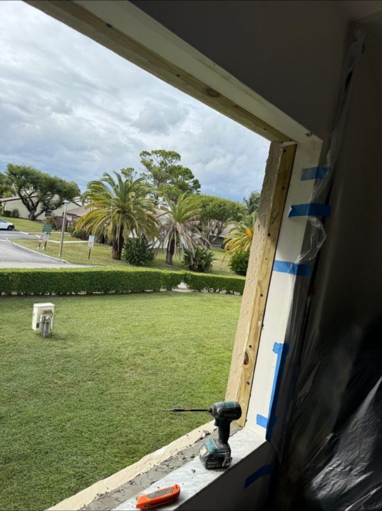 Window opening with old unit removed during a window replacement by Onel Construction in South Florida